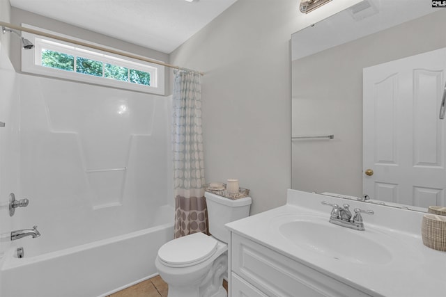 full bathroom featuring shower / tub combo, vanity, tile patterned flooring, and toilet