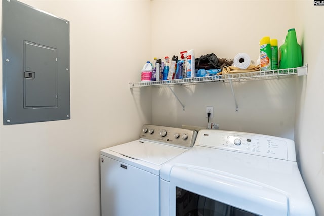 laundry room featuring electric panel and washing machine and dryer