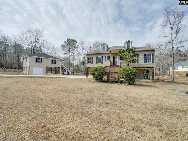 view of front of property with a garage and a front yard