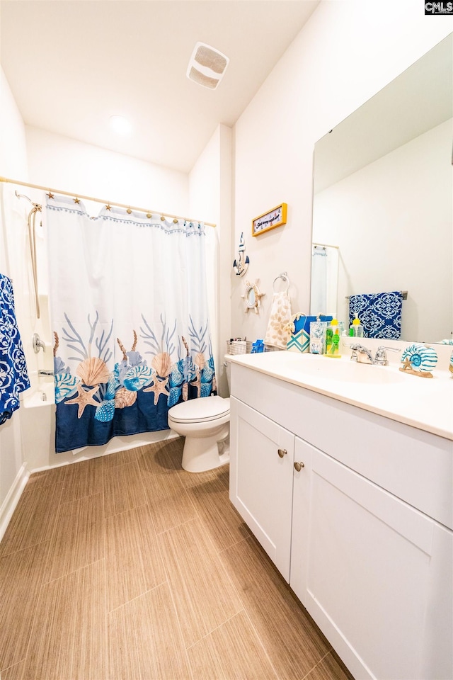 full bathroom featuring vanity, toilet, and shower / bath combo with shower curtain