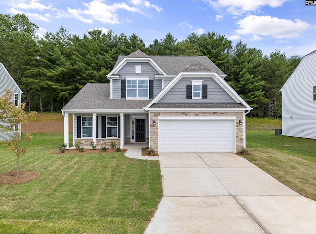 craftsman house with a garage, a porch, and a front yard