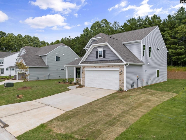 view of front of property with a garage and a front yard