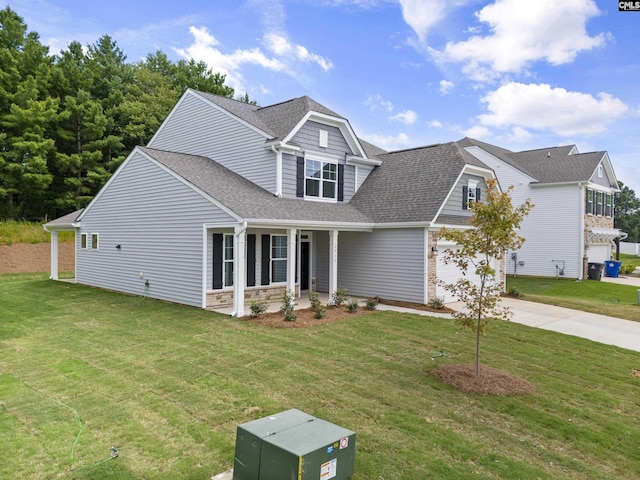 view of front of home featuring a garage and a front lawn