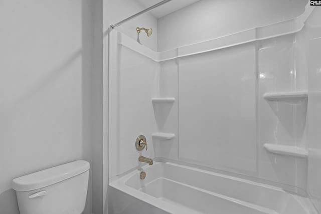 bathroom with shower / bathtub combination and toilet