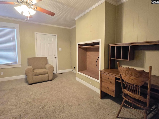 carpeted office space with crown molding and ceiling fan