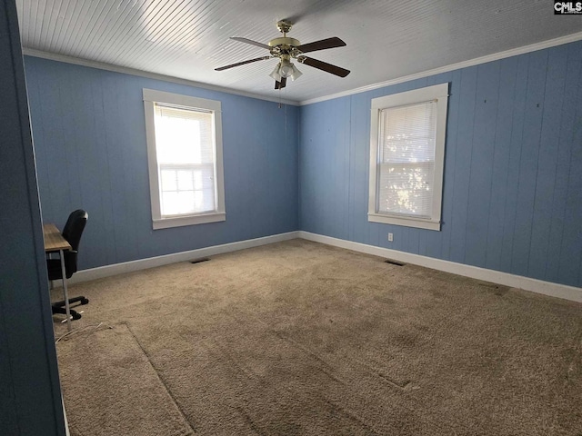 interior space with crown molding, carpet floors, and ceiling fan