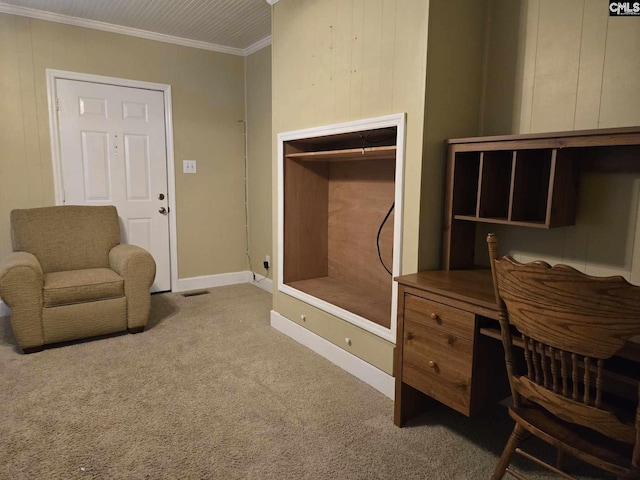 carpeted office space featuring ornamental molding and wood walls