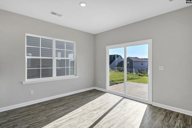 empty room featuring dark hardwood / wood-style floors