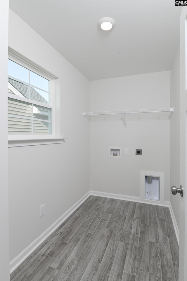 laundry room featuring electric dryer hookup, washer hookup, and wood-type flooring