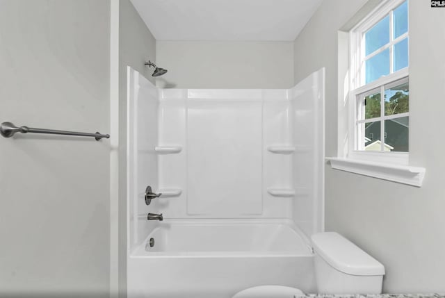 bathroom with shower / tub combination and toilet