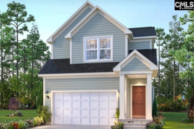 view of front of house with a garage and a front yard