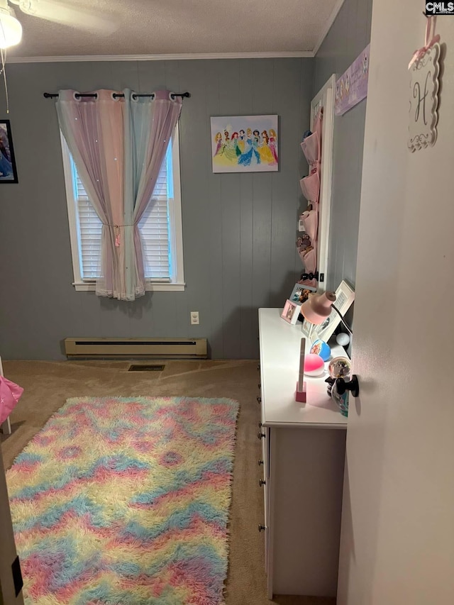 carpeted bedroom with a baseboard radiator and ornamental molding