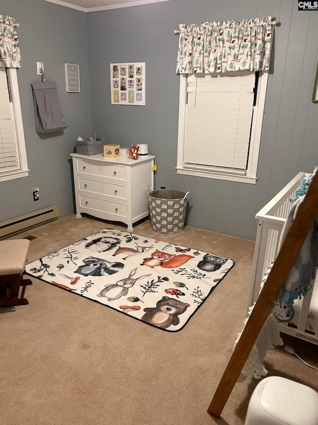 carpeted bedroom with a nursery area and a baseboard heating unit