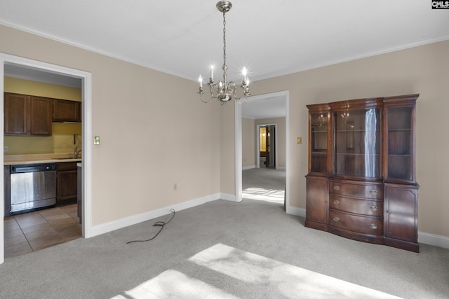 unfurnished dining area with light carpet, sink, a notable chandelier, and ornamental molding