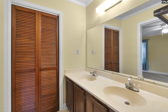 bathroom with ornamental molding and vanity