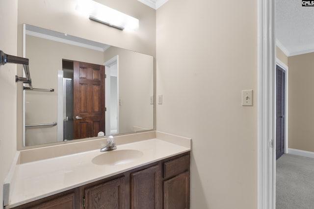 bathroom with vanity, crown molding, and a textured ceiling