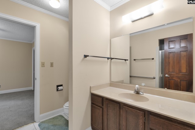 bathroom with tile patterned flooring, vanity, ornamental molding, a textured ceiling, and toilet