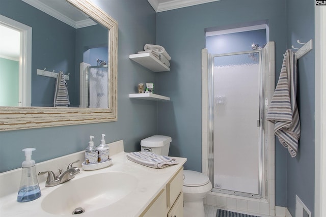 bathroom featuring vanity, a shower with shower door, ornamental molding, and toilet