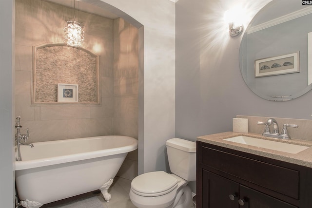 bathroom with vanity, a washtub, a chandelier, and toilet