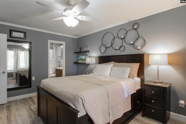 bedroom with connected bathroom, crown molding, light hardwood / wood-style flooring, and ceiling fan