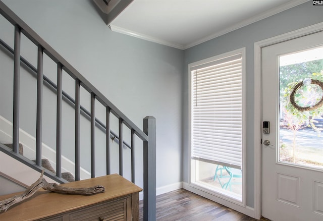 entrance foyer featuring ornamental molding and light wood-type flooring