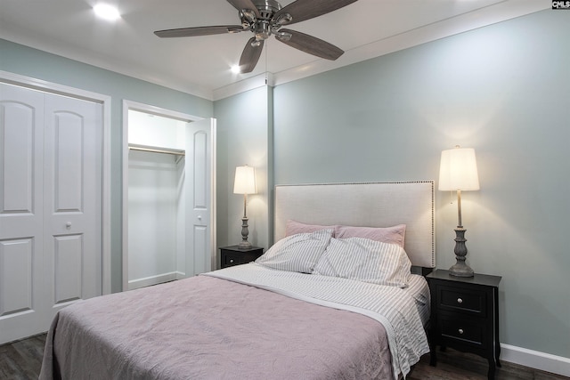 bedroom featuring dark hardwood / wood-style floors, ceiling fan, and a closet