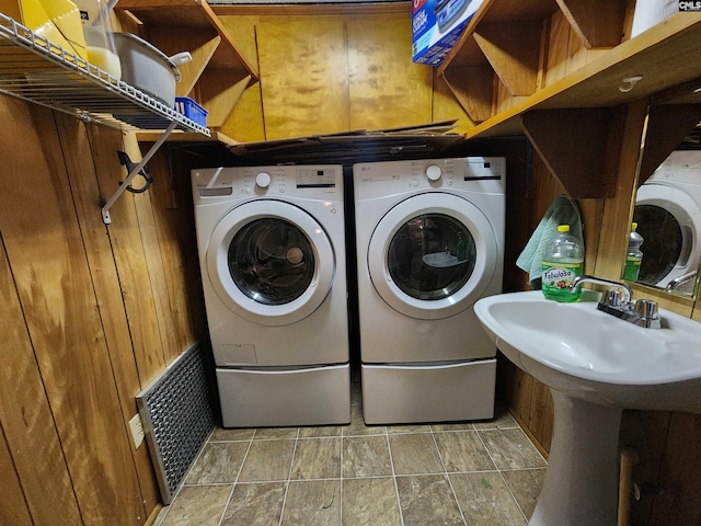 laundry room with separate washer and dryer