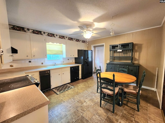 kitchen featuring extractor fan, black appliances, sink, and white cabinets