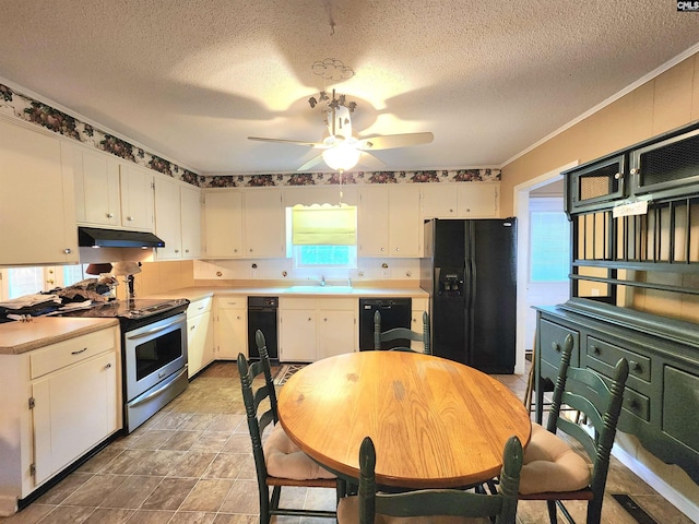 kitchen with sink, black appliances, and white cabinets