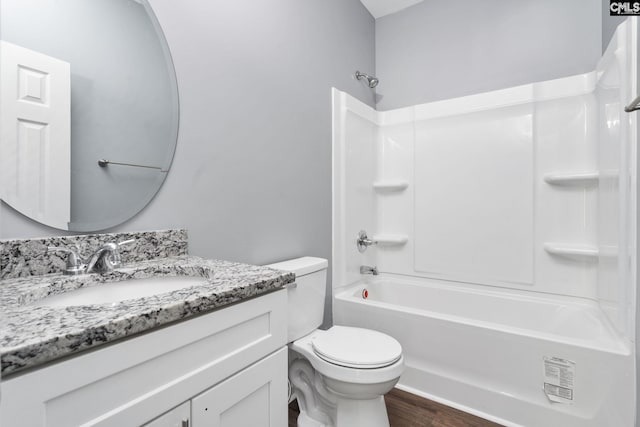 full bathroom featuring vanity, wood-type flooring, toilet, and  shower combination