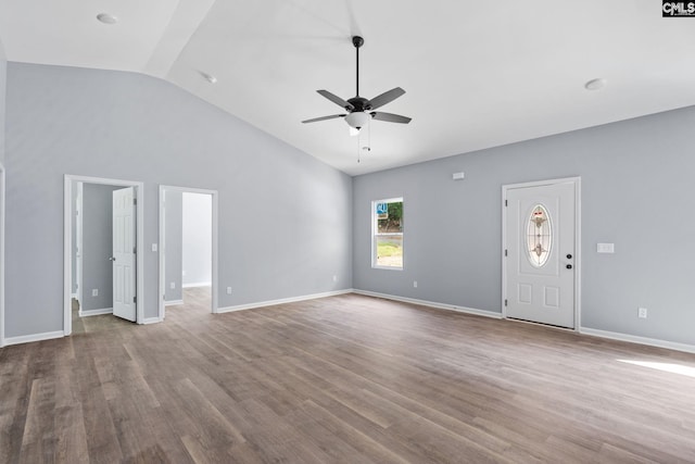 unfurnished living room with lofted ceiling, hardwood / wood-style floors, and ceiling fan