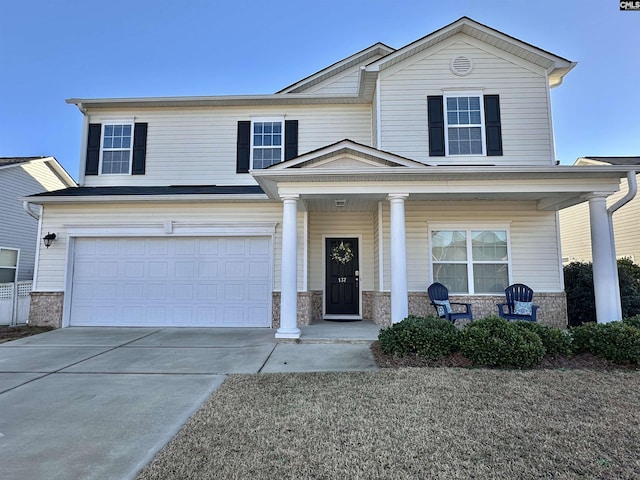 view of front of home featuring a garage and covered porch