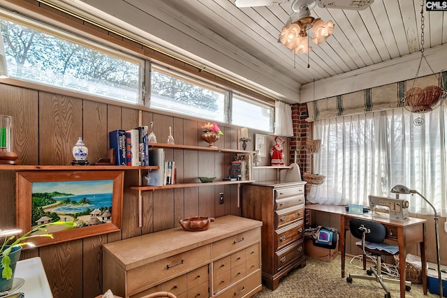 office featuring ceiling fan, light colored carpet, wooden walls, and wooden ceiling