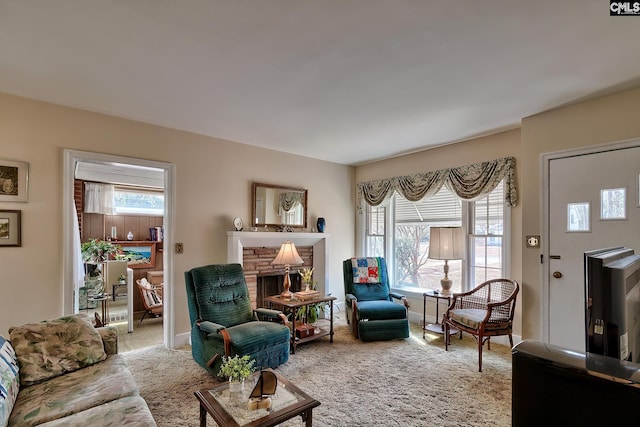 carpeted living room featuring plenty of natural light