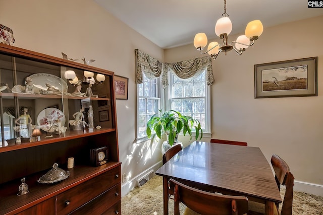 dining room with a notable chandelier