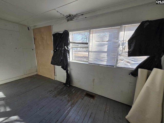 unfurnished room featuring dark hardwood / wood-style flooring