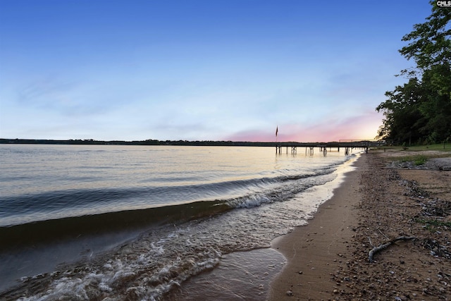 property view of water featuring a beach view