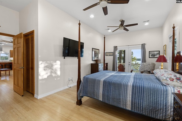 bedroom with light hardwood / wood-style flooring, ceiling fan, french doors, access to outside, and a closet