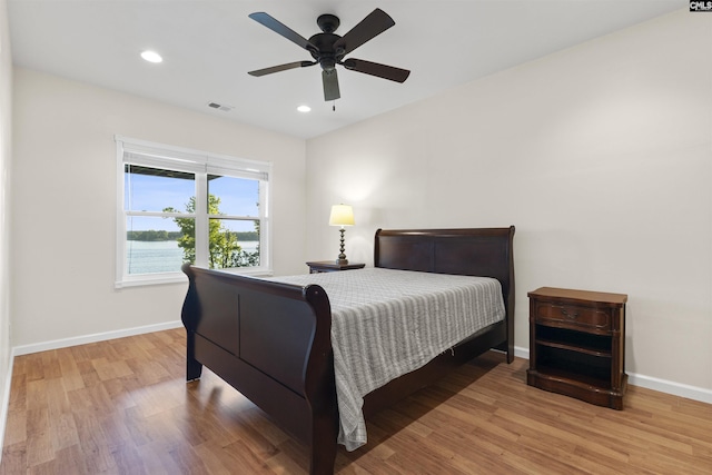 bedroom featuring ceiling fan and light hardwood / wood-style floors