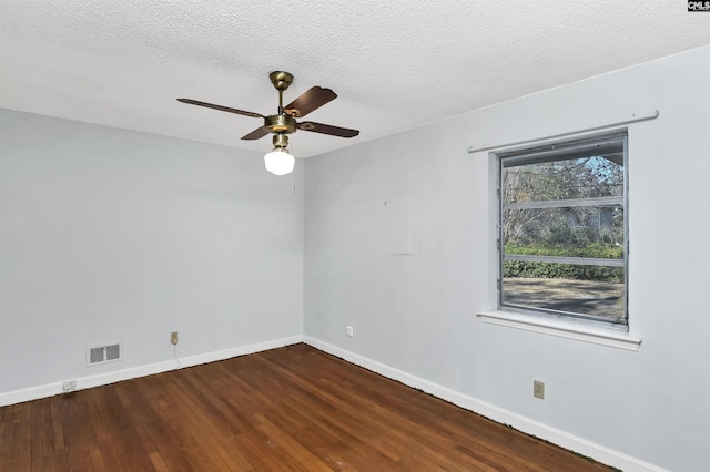 spare room featuring hardwood / wood-style flooring, ceiling fan, and a textured ceiling