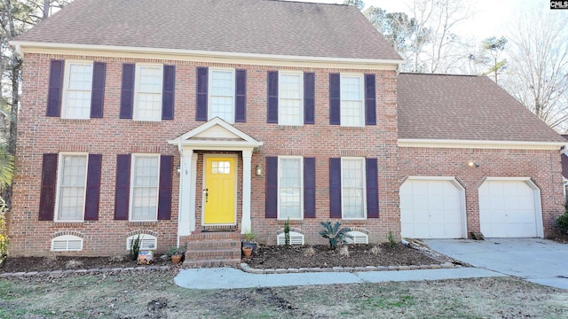 colonial inspired home with a garage