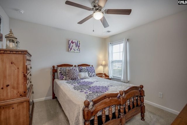 bedroom featuring light carpet and ceiling fan