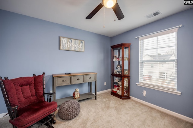 sitting room with light carpet and ceiling fan