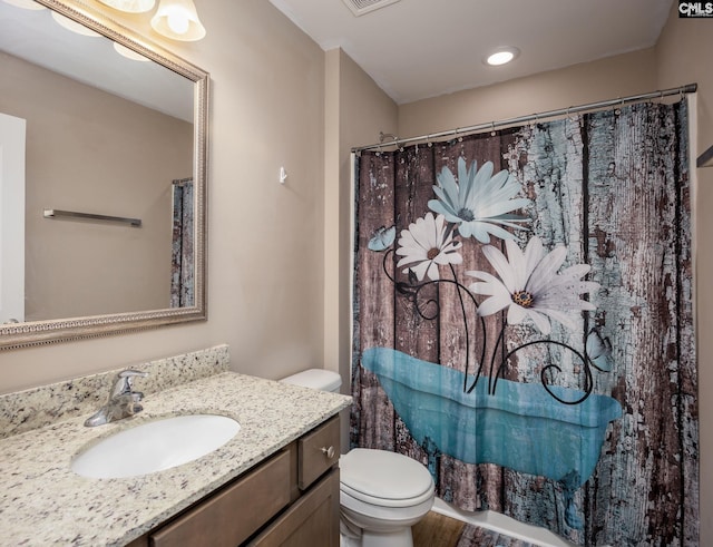 bathroom with a shower with curtain, vanity, and toilet