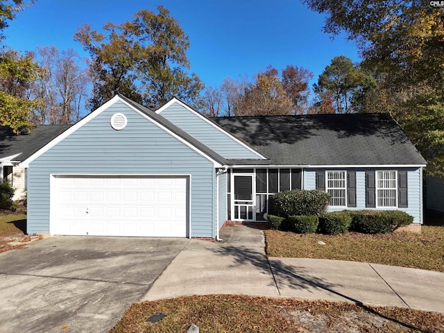 ranch-style house featuring a garage