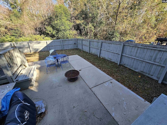 view of patio / terrace featuring an outdoor fire pit