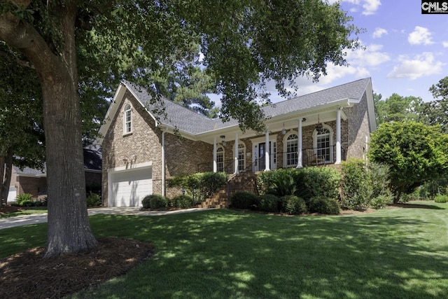 view of front of home featuring a garage and a front lawn