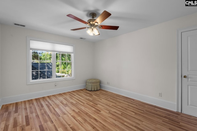 unfurnished room featuring ceiling fan and light wood-type flooring