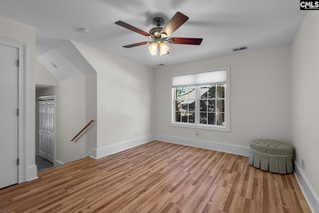 unfurnished room featuring ceiling fan and light wood-type flooring