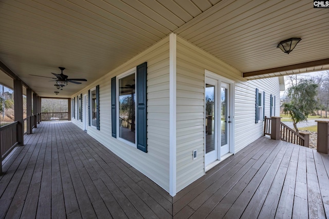 wooden deck with covered porch and ceiling fan